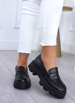 Black loafers with lug sole