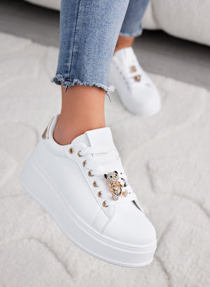 White sneakers with jewel applications and gold teddy