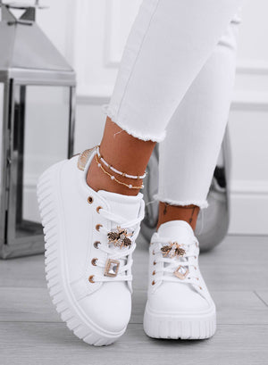 White sneakers with gold bee jewel embellishment