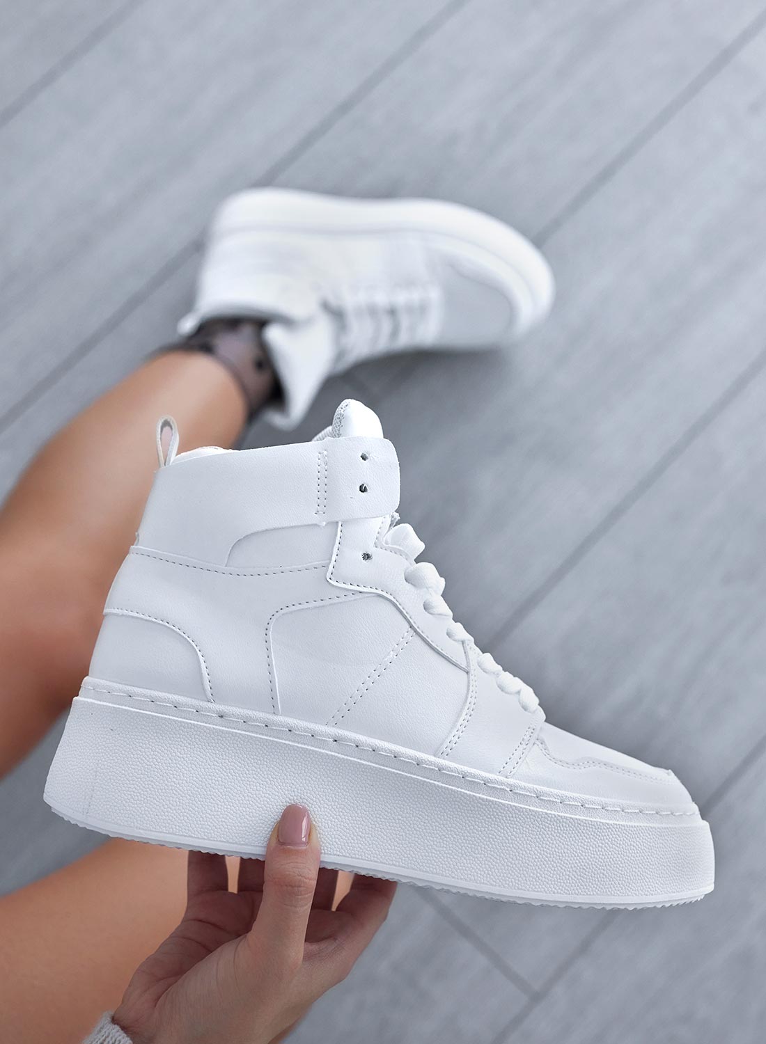 White high-top sneakers with laces