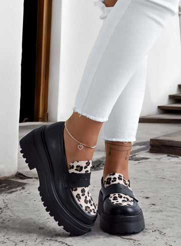Black loafers with animal print inserts