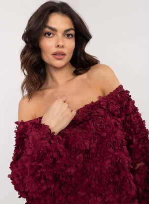 Burgundy top with floral appliqués and boat neckline