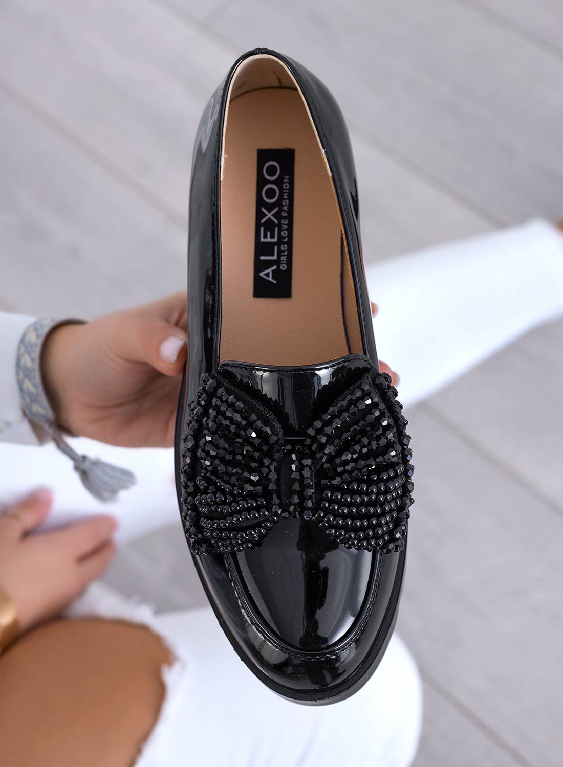 Mocassini neri in vernice con fiocco in strass