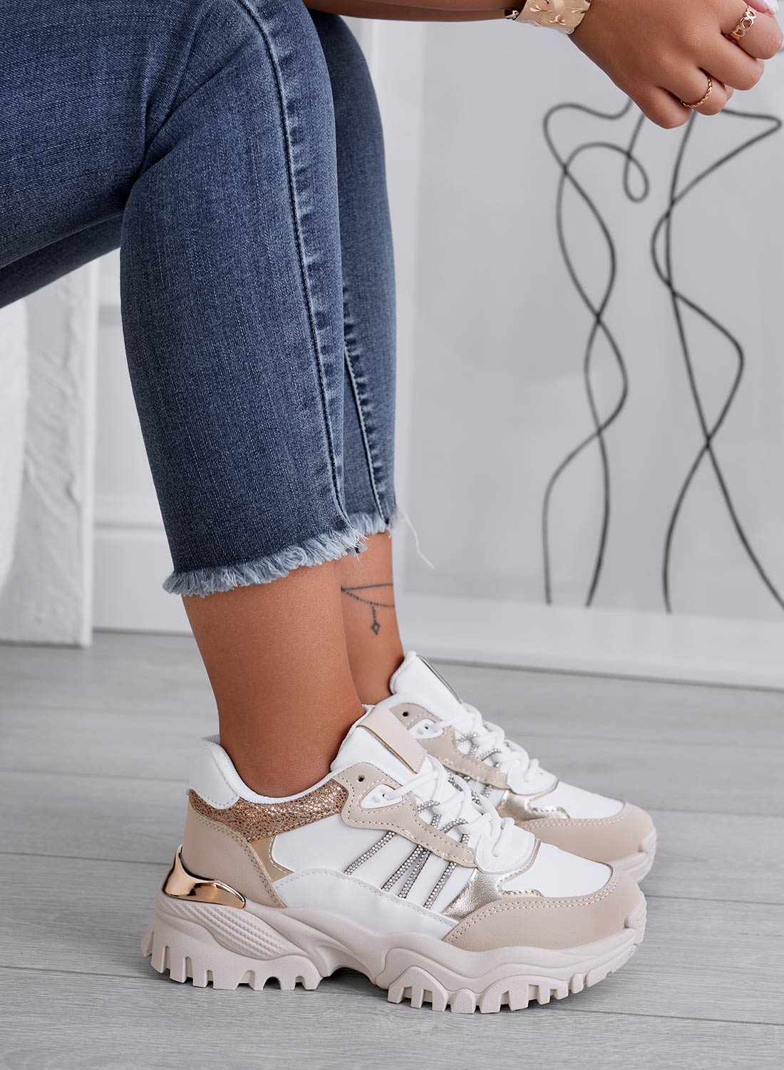 White sneakers with beige and gold inserts