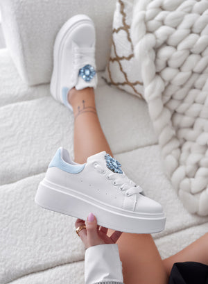 White sneakers with light blue heel and jewel
