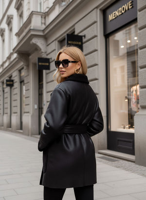 Oversized black shearling jacket with contrasting pockets