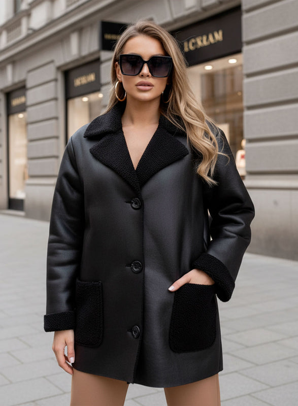 Oversized black shearling jacket with contrasting pockets