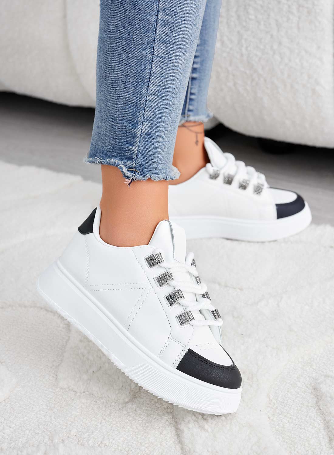 White and black sneakers with rhinestone inserts