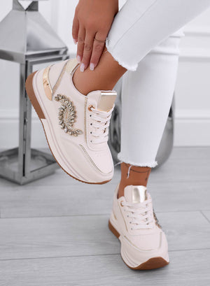 Beige sneakers with gold jewel embellishment
