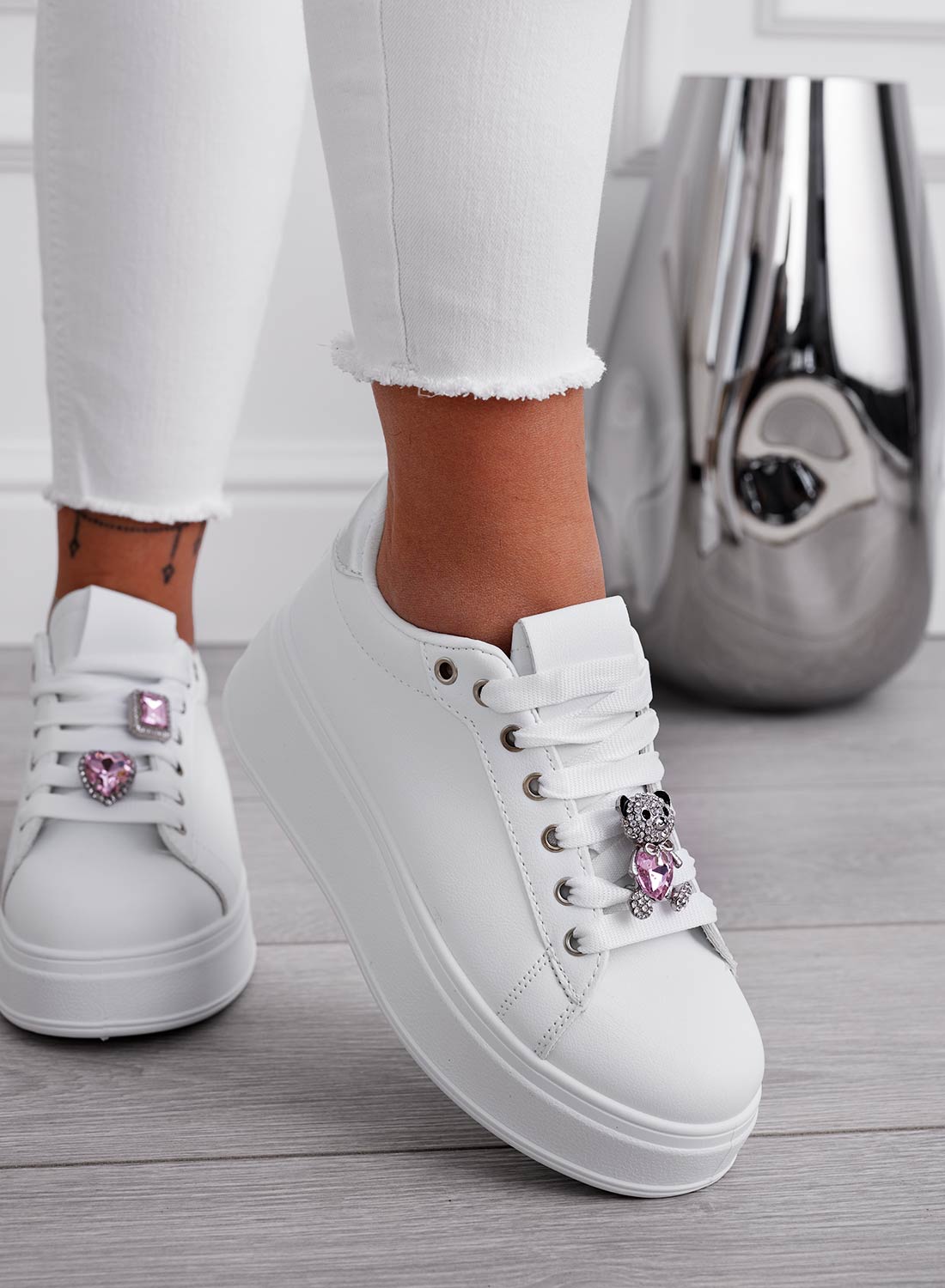 White sneakers with silver heel and pink jewel teddy bear