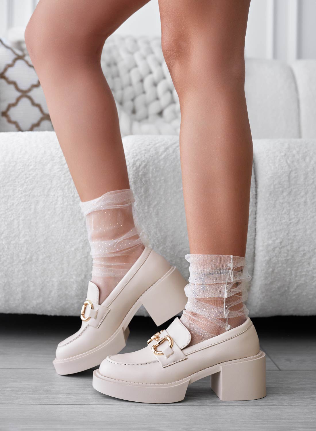 Beige platform loafers with gold buckle