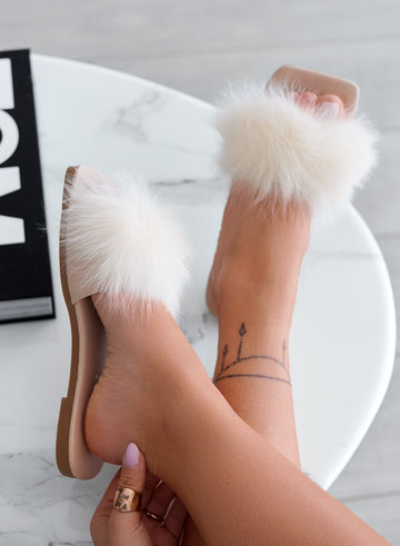 Beige slip-on sandals with faux fur