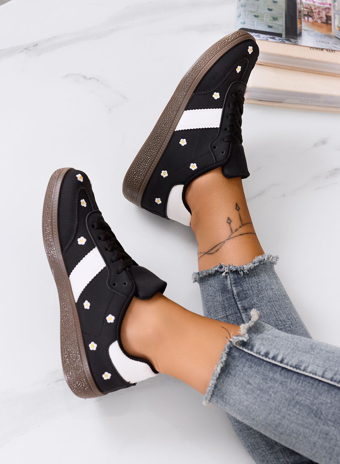 WESTON - Black sneakers with embroidered daisies and brown sole