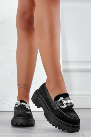 Black loafers with jewel embellishment