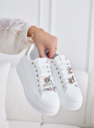 White sneakers with gold heel and jewel embellishments