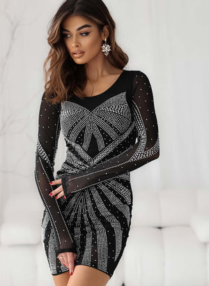 Black dress in sheer fabric embellished with rhinestones