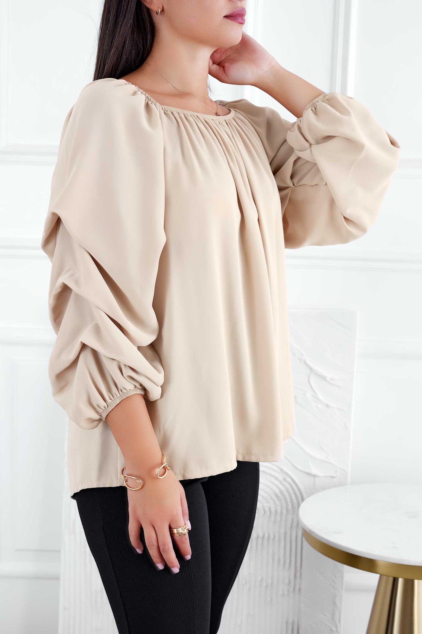 Beige blouse with ruched sleeves