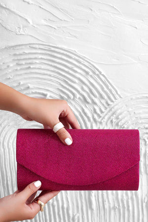 Fuchsia B220 clutch bag in laminated fabric