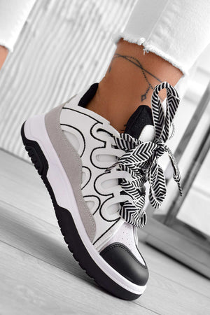 White sneakers with contrasting black panels