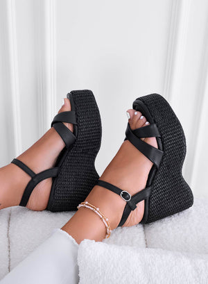 Black sandals with braided wedge and ankle strap