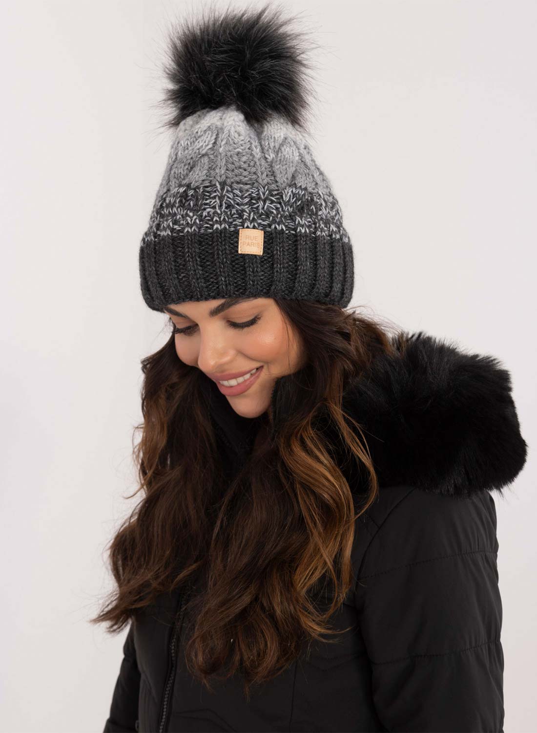 Gray hat with inner padding and pompom