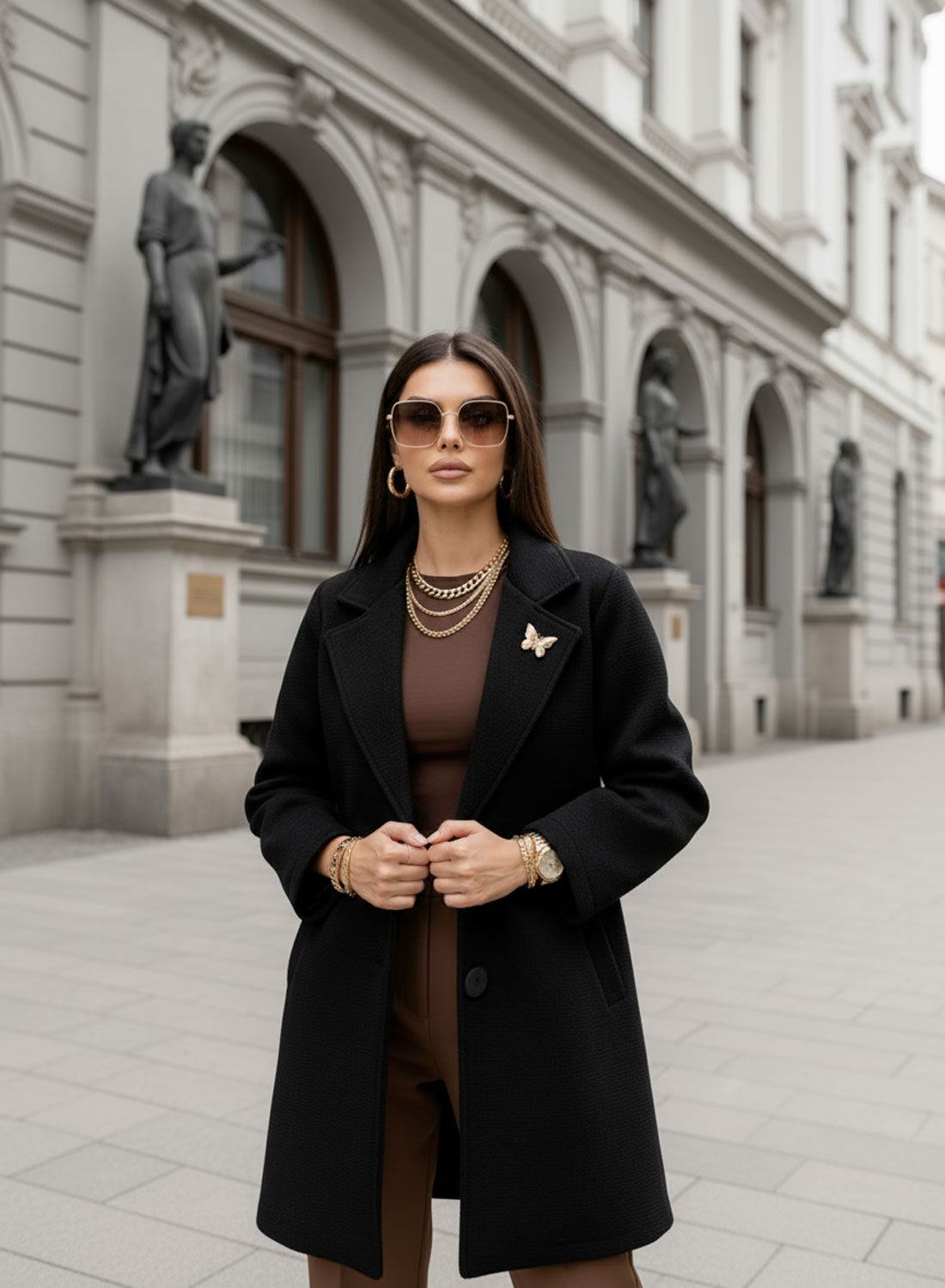 Black coat with black button and brooch