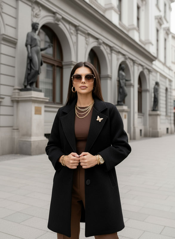 Black coat with black button and brooch
