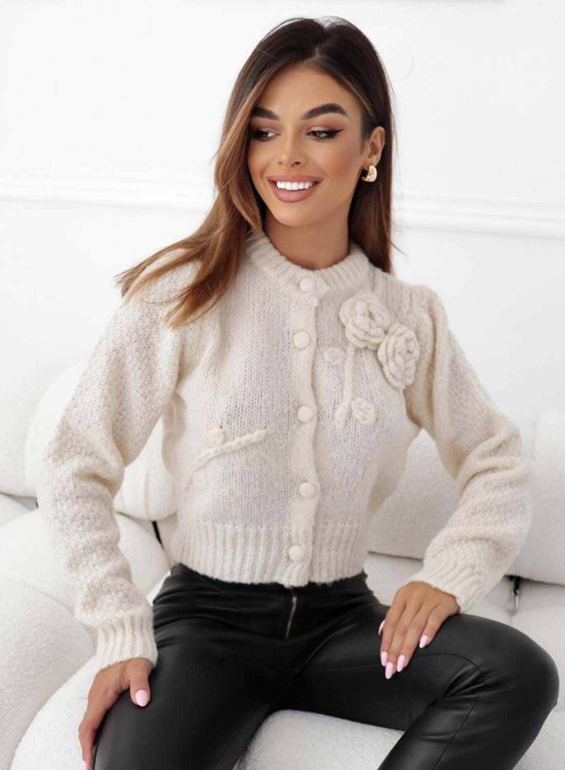 Beige knit cardigan with floral appliqué