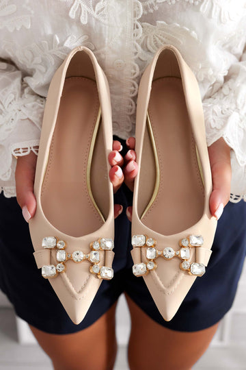 Beige pumps with jeweled embellishments