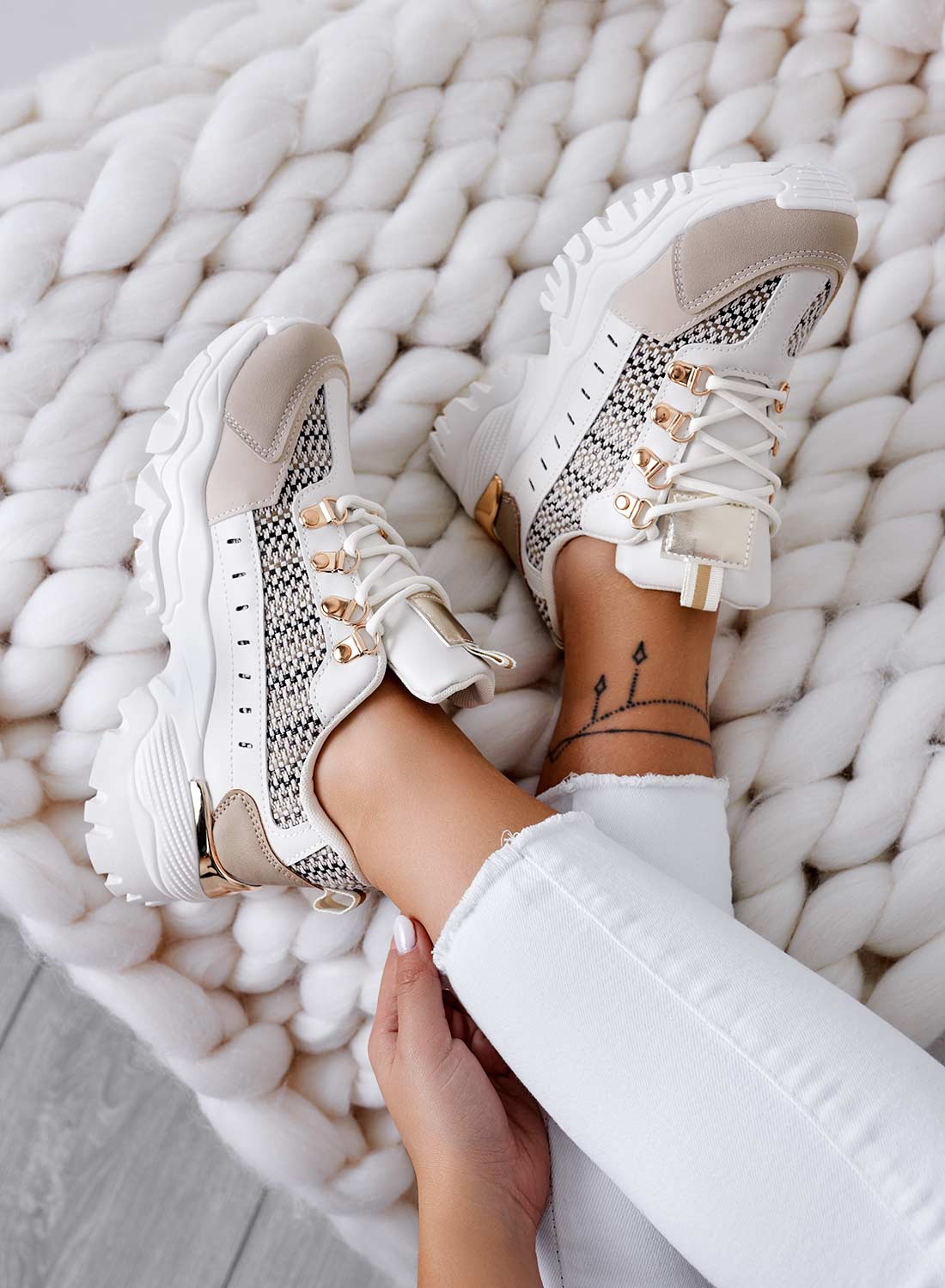 Beige sneakers with contrasting panels and fabric inserts