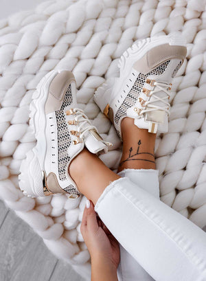 Beige sneakers with contrasting panels and fabric inserts