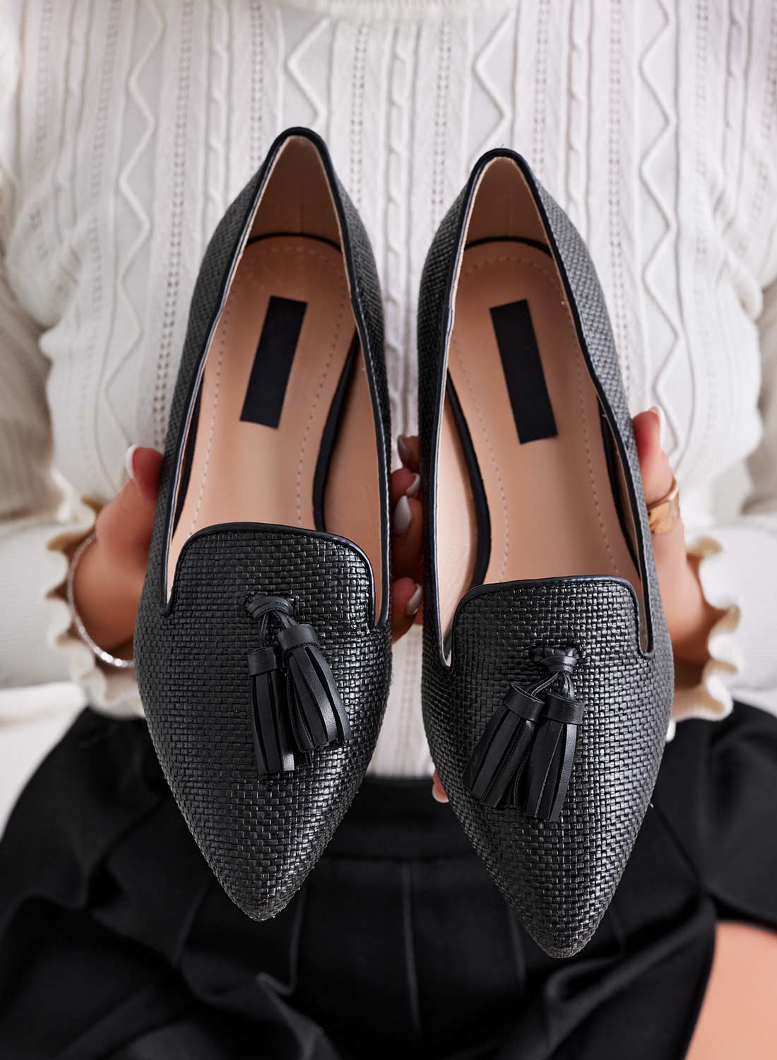 Black pointed loafers with tassels