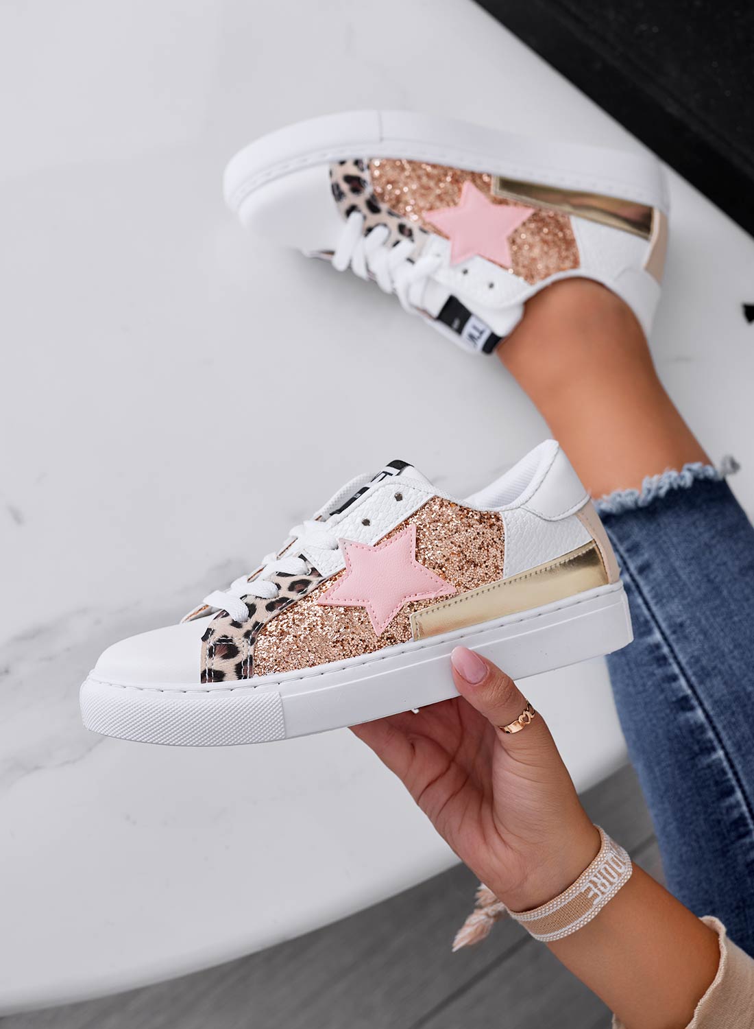 White sneakers with star and rose gold glitter inserts