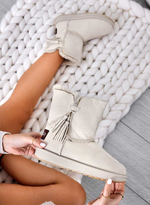 Beige padded ankle boots with tassels