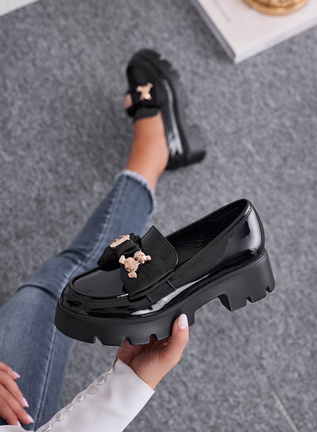 GIUDITTA - Black patent loafers with bow and gold teddy brooch