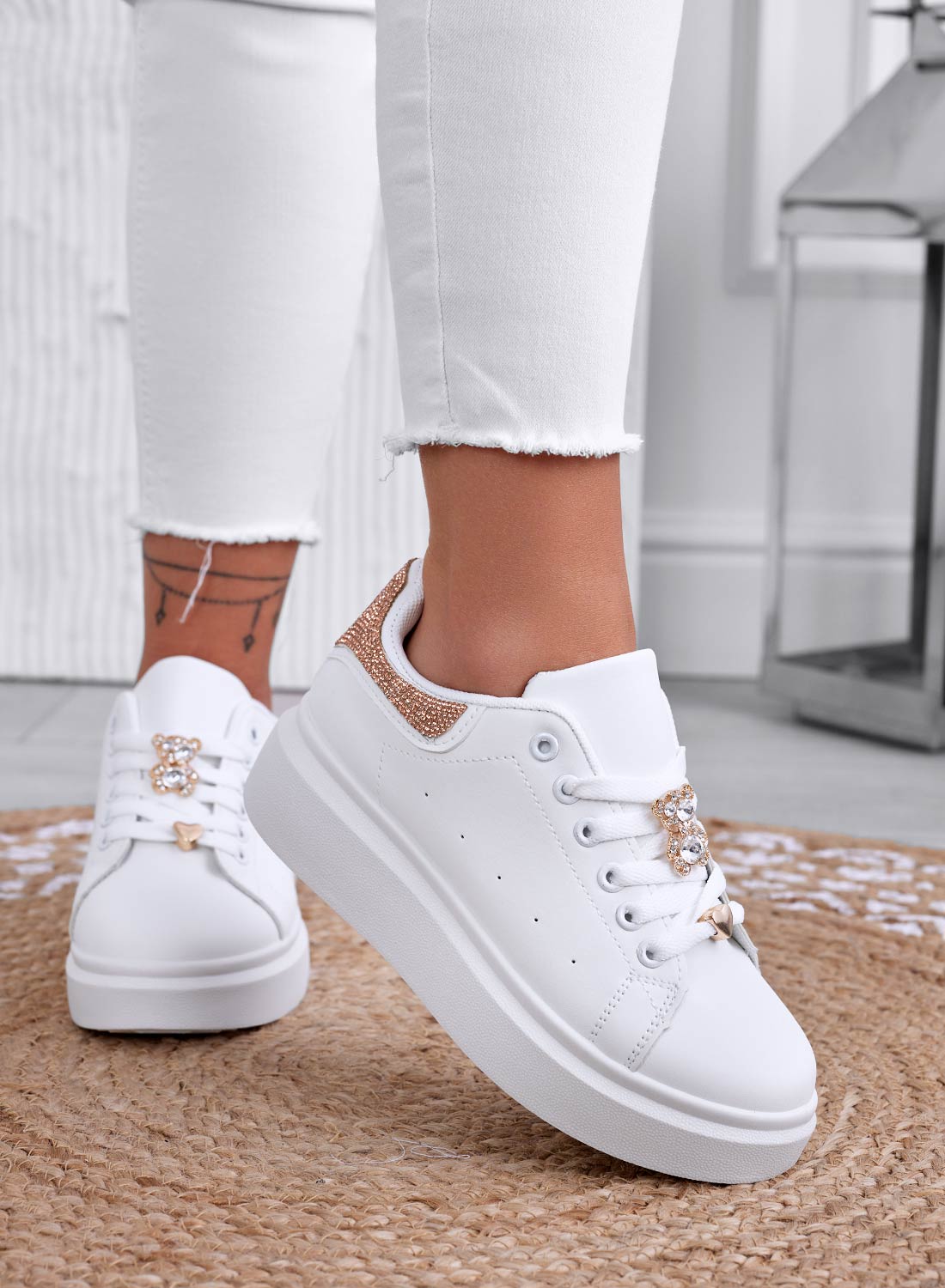 White sneakers with jewel appliqué and rose gold rhinestone heel