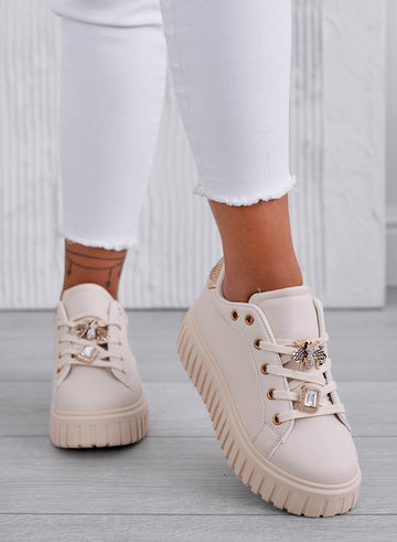 Beige sneakers with jeweled bee embellishment