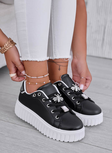 Black sneakers with gold bee jewel embellishment
