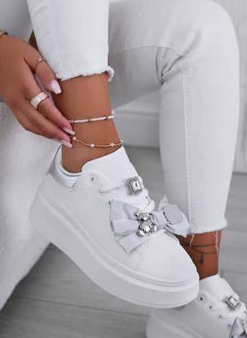 White sneakers with gray bow and silver teddy brooch