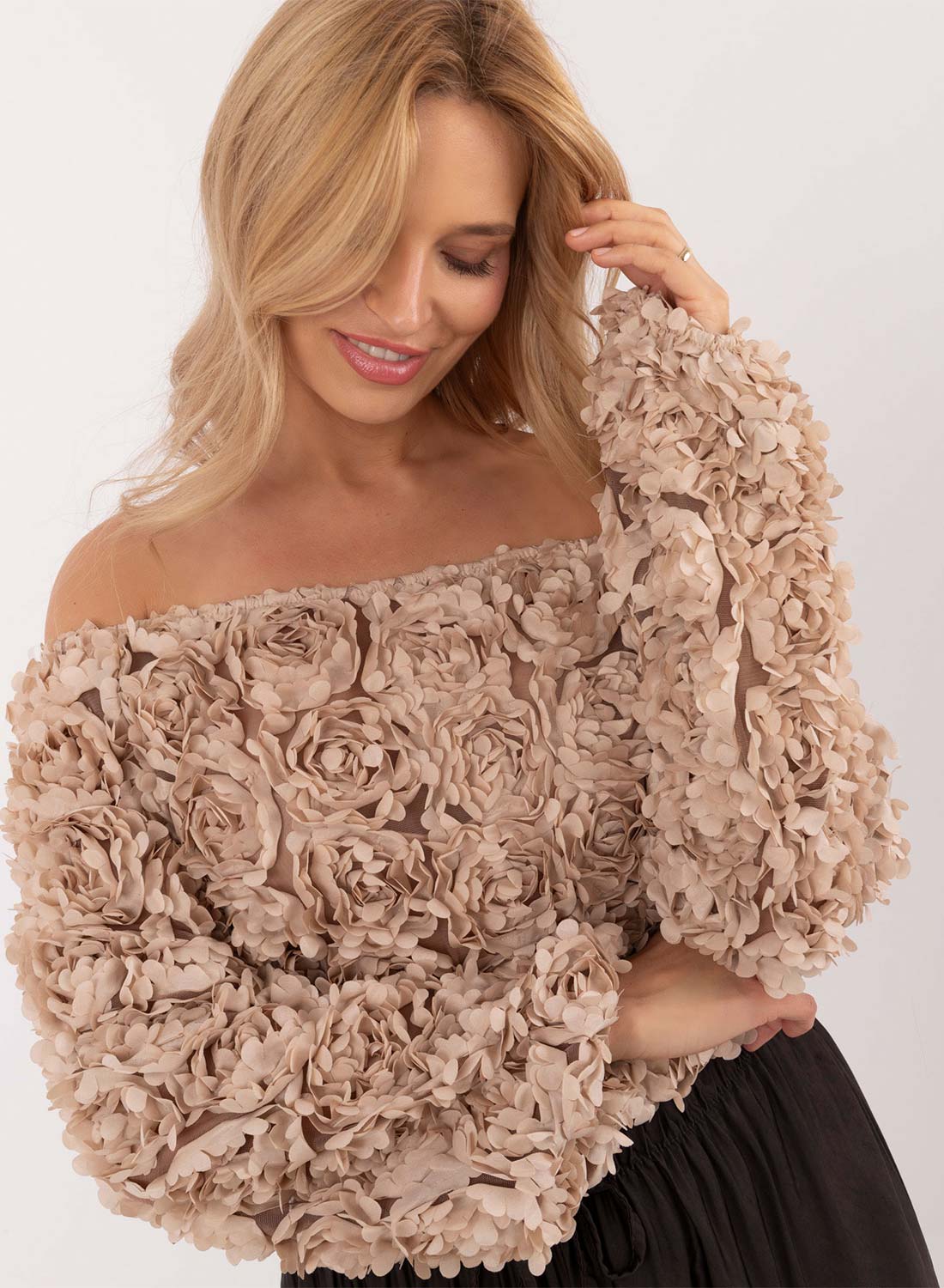 Beige sweater with floral appliqués and boat neckline