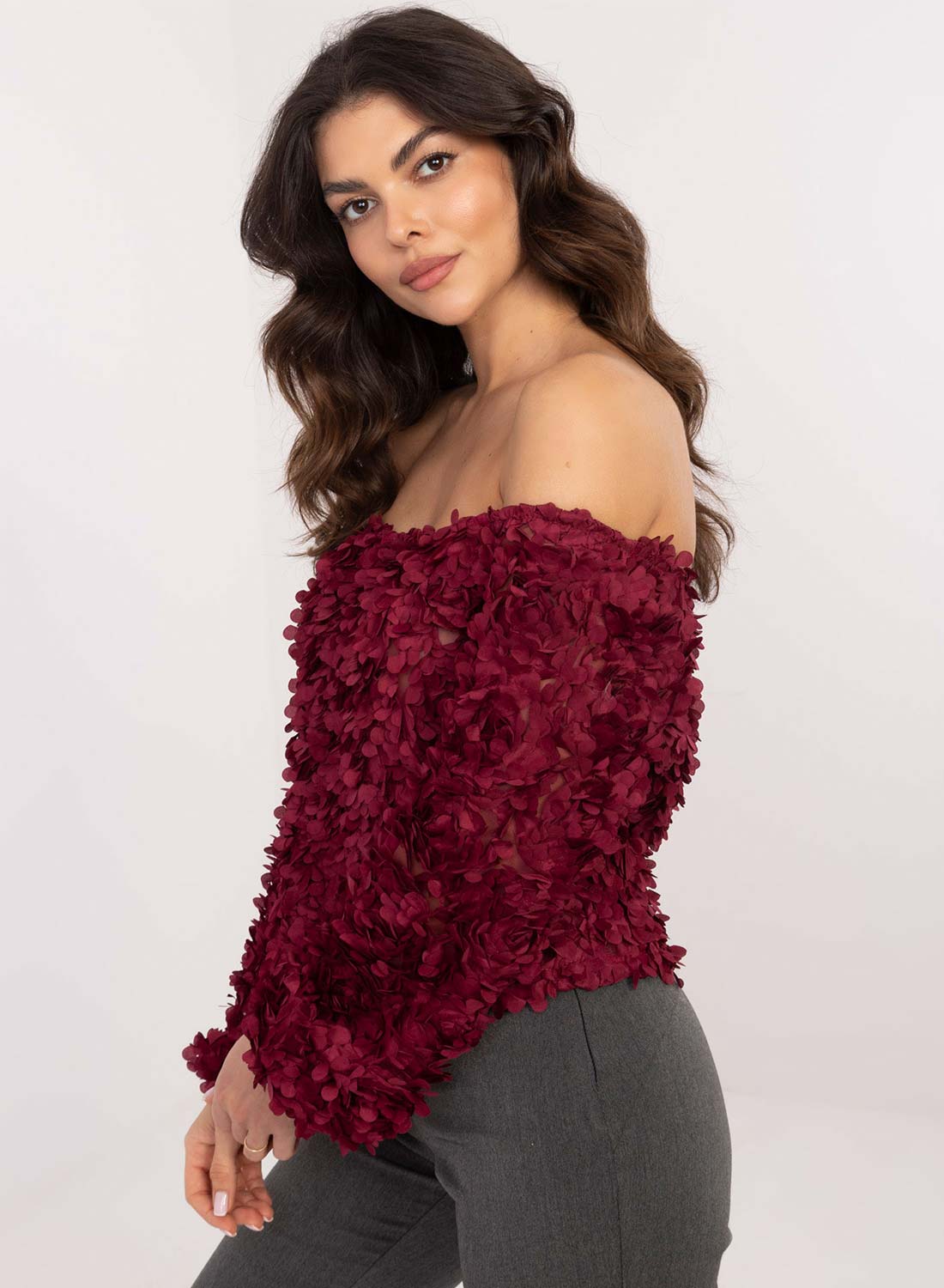 Burgundy top with floral appliqués and boat neckline