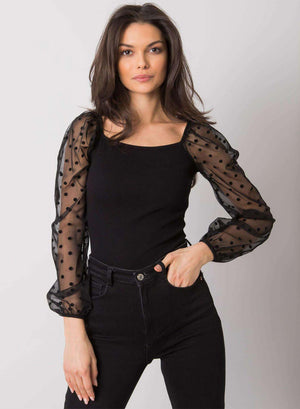 Black top with sheer sleeves and polka dots