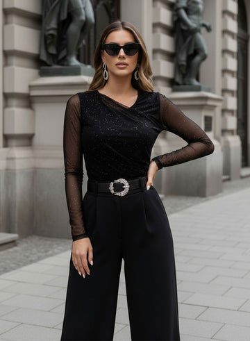 Maglia body nero con manica in velo e glitter