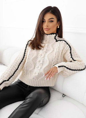 Beige sweater with contrasting black embroidery