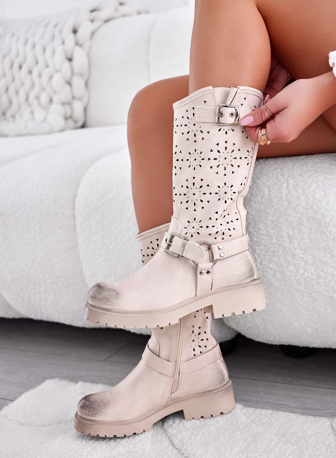 Beige perforated ankle boots with buckles