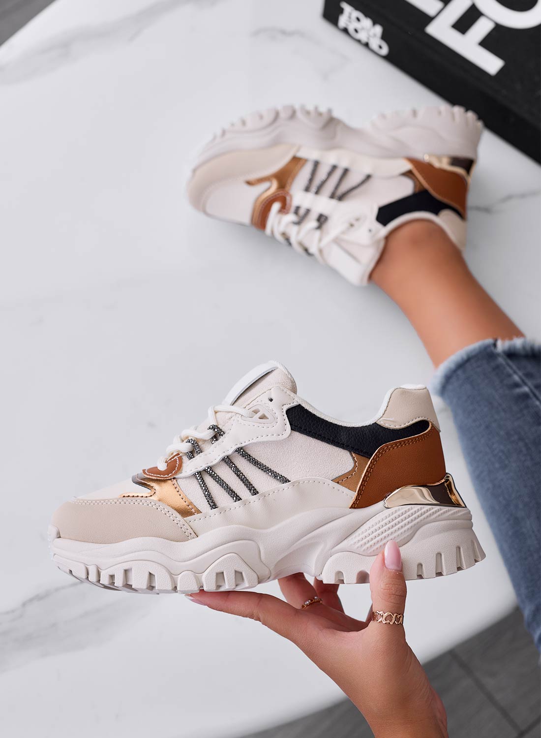 Beige sneakers with brown inserts