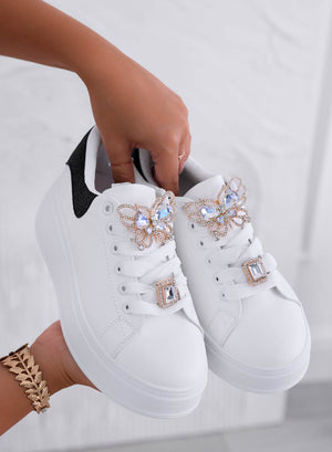 White sneakers with jeweled butterfly applique and black heel