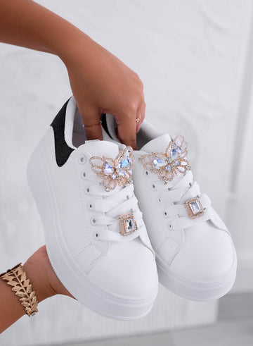 White sneakers with jeweled butterfly applique and black heel