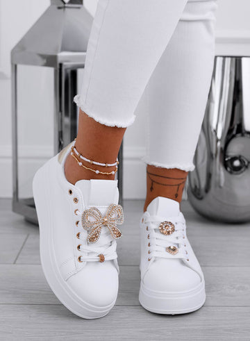 White sneakers with gold jewel bow
