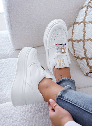 White sneakers with jewel embellishments